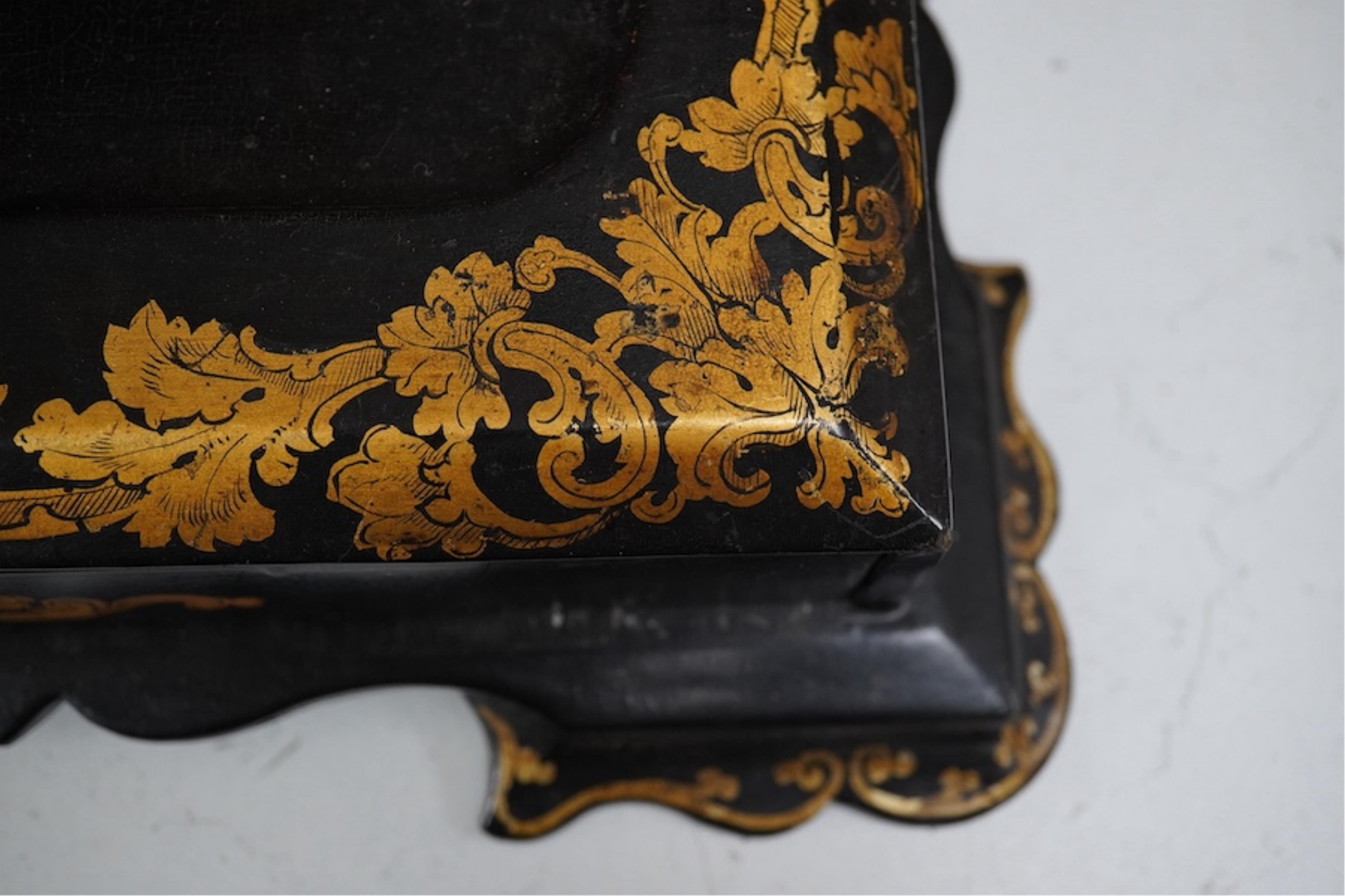 A Victorian black lacquer and gilt decorated two bottle ink stand with drawer. 36cm sided x 28cm deep. Condition - some lacquered missing.